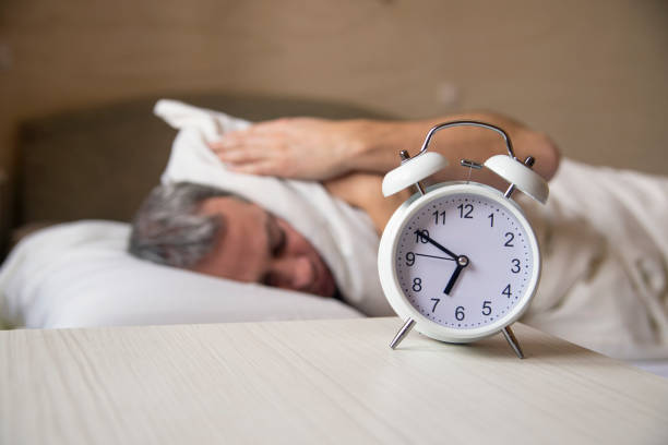 istock Man trying to sleep, when alarm clock ringing 640098676