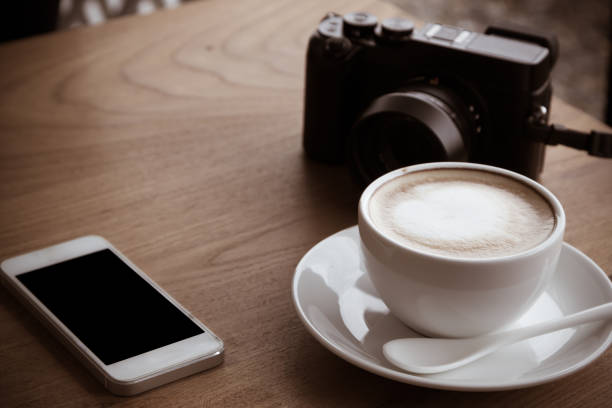 istock coffee camera and smartphone on wooden table 640099050