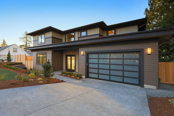 istock New construction home with low slope roof and brown siding. 640101612