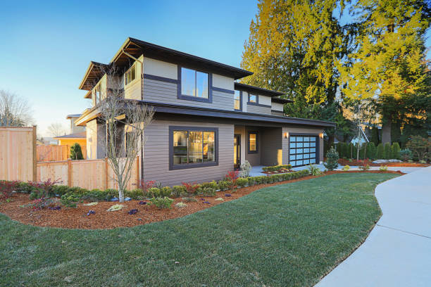 istock New construction home with low slope roof and brown siding. 640101770