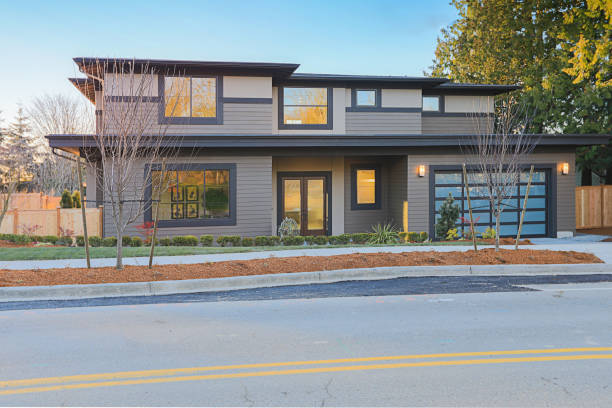 istock New construction home with low slope roof and brown siding. 640102540