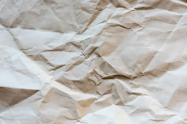 Light-brown very crumpled paper, large texture, background