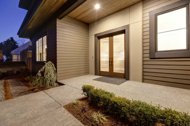 istock New construction home with low slope roof and brown siding. 640104296