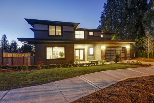 istock New construction home with low slope roof and brown siding. 640104458