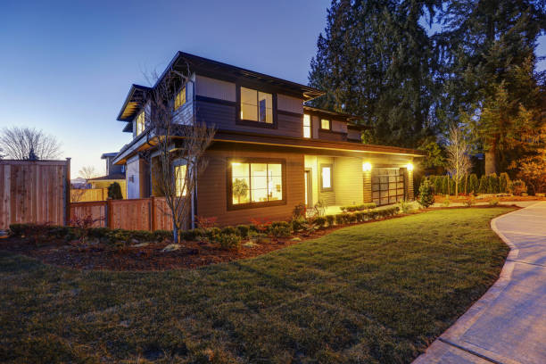 istock New construction home with low slope roof and brown siding. 640104610