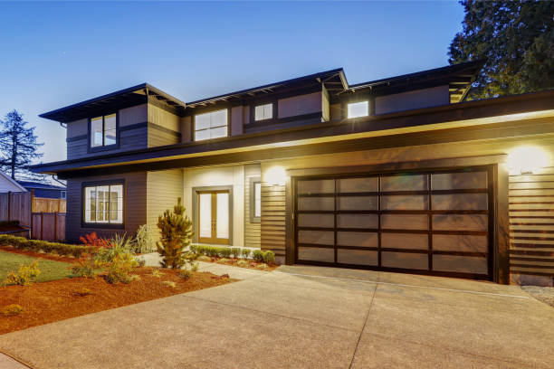 istock New construction home with low slope roof and brown siding. 640104734