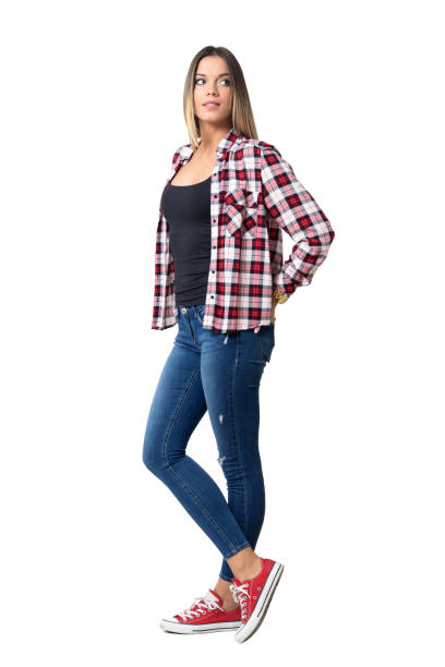 istock Casual beautiful girl with hands in back pockets looking behind 640106668