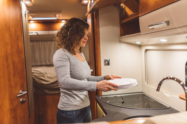istock Young girl doing dishes in a motorhome 640107588