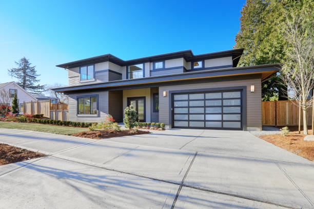 istock New construction home with low slope roof and brown siding. 640107880
