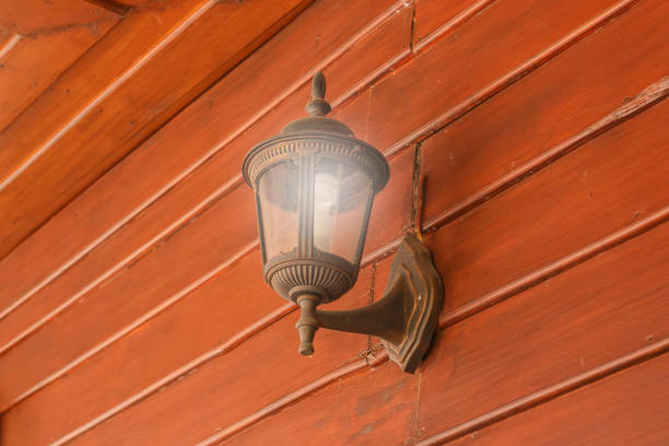istock old wall lamp on the old wooden floor 640108326