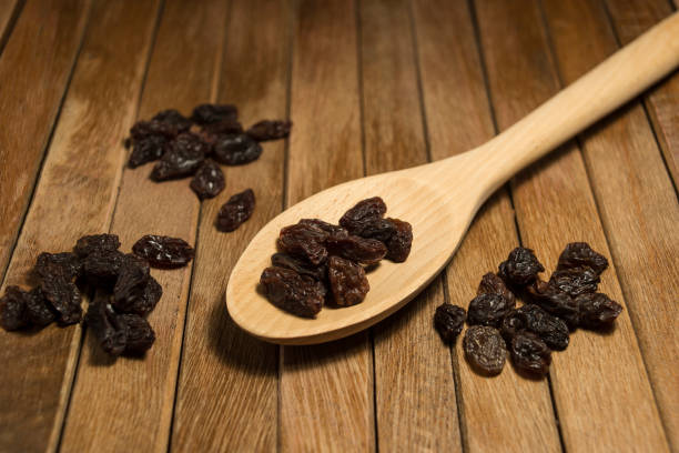 istock Raisins on wooden cooking spoon 640108336