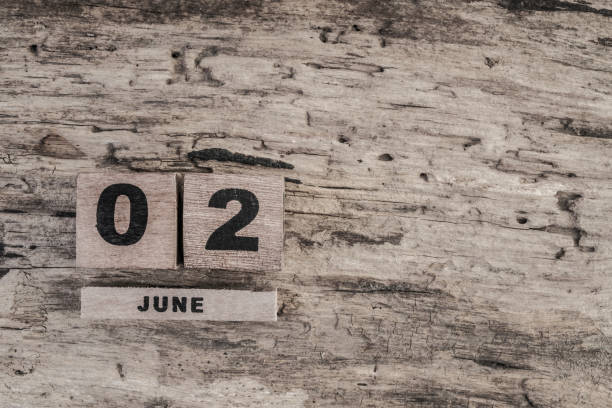 Cube calendar for june on wooden background