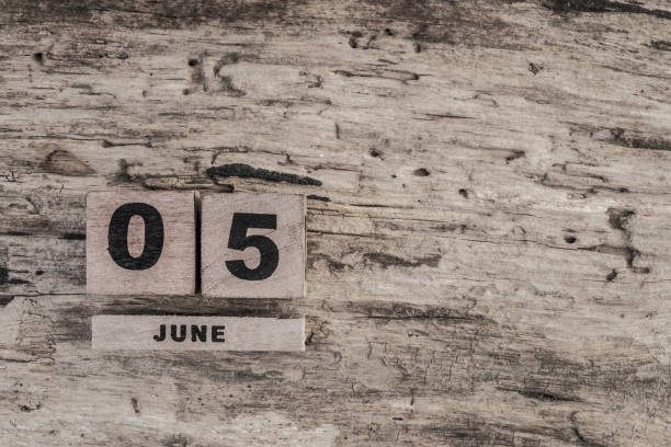 Cube calendar for june on wooden background