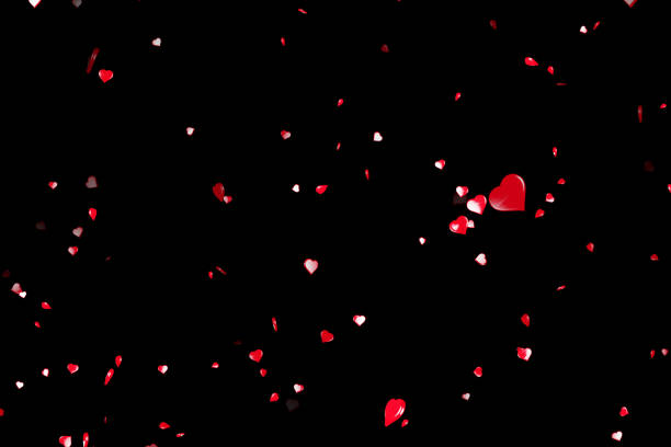 istock valentine day red hearts shape flowing on black background 640110408