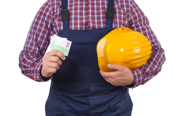 istock Engineer holding his helmet and  monthly salary 640111924
