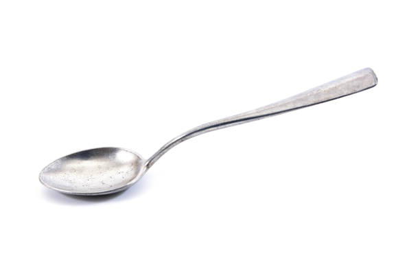 istock Silver tea spoon.Old aluminium tea spoon isolated on white background 640112134