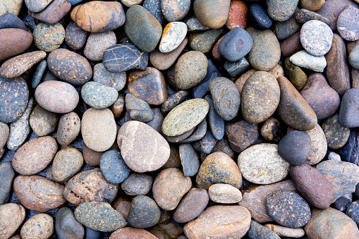 Pebbles background.Gravel background.Colorful pebbles background.