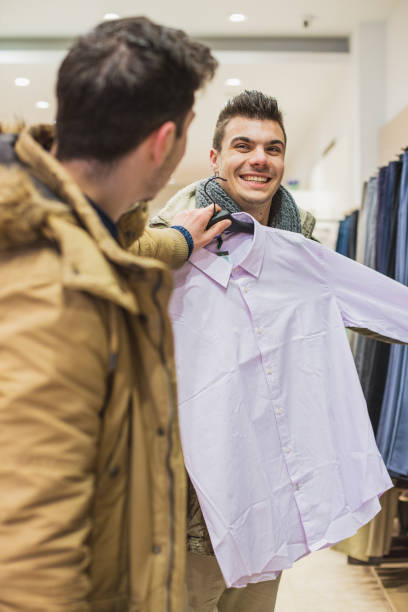 istock Choosing shirt in clothing store 640115150