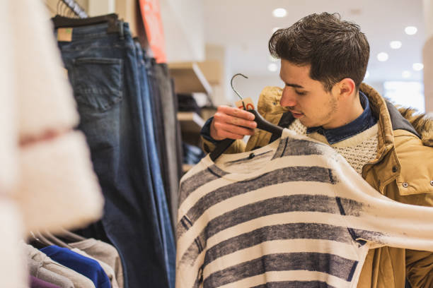 istock Man shopping in boutique 640115242