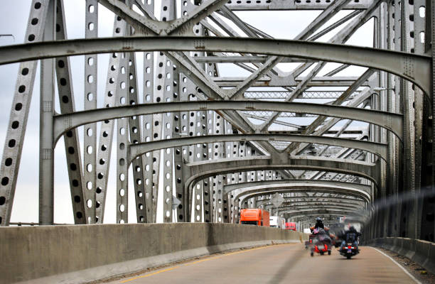 istock Riding Bike Through Huge Bridge 640115374