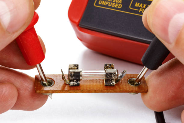istock Test the fuse with a multimeter on a white background 640116918