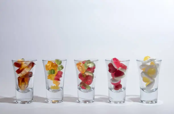 Photo of Gummy sweets in glasses.