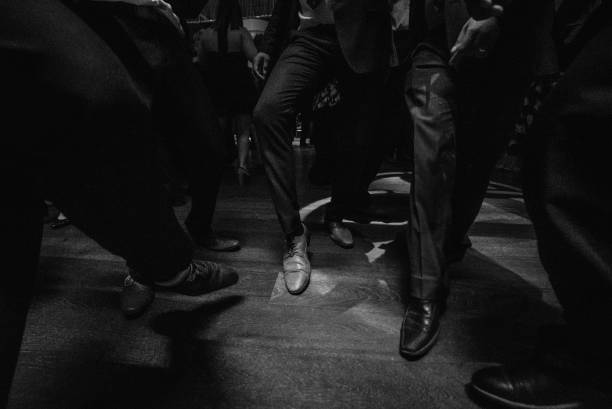 istock people in suit dancing on dance floor 640121028
