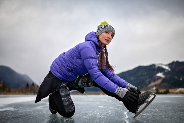 istock Woman fixing ice skate shoe 640122780