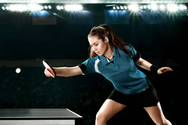 Portrait Of Young Woman Playing Table Tennis