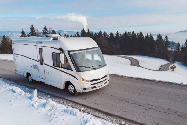 istock Young guy driving a luxury caravan in the winter 640124272