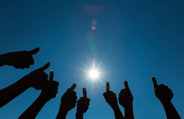 istock Silhouette of many thumbs up 640126842