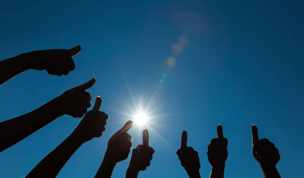 istock Silhouette of many thumbs up 640126968