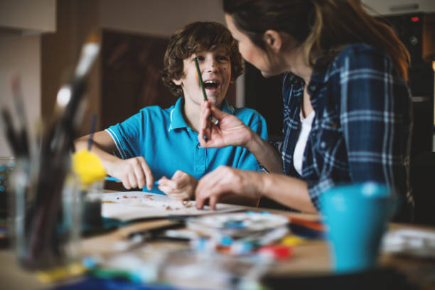 istock Mother and son coloring together. 640127078