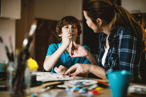 istock Mother and son coloring together. 640127302