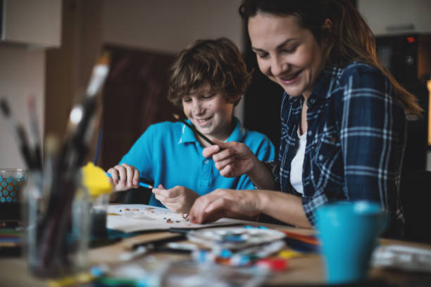 istock Mother and son coloring together. 640127500