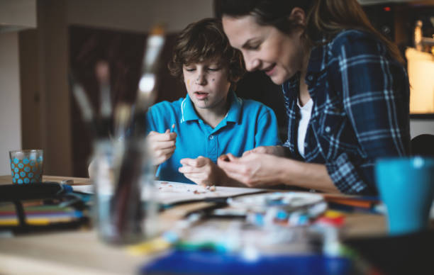 istock Mother and son coloring together. 640127690