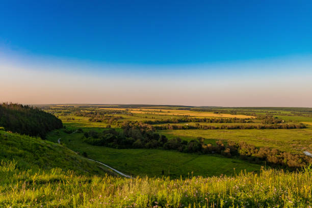 istock Evening view of the green valley from a high hill 640128650