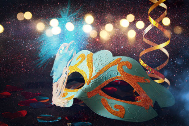 istock elegant venetian, mardi gras mask on glitter background 640129030