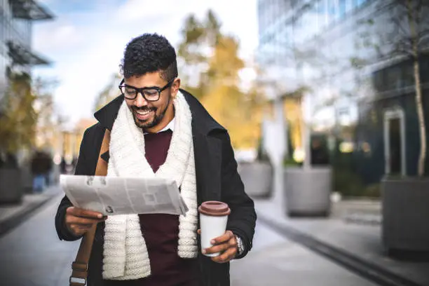 Photo of Young Businessman Reading Breaking News