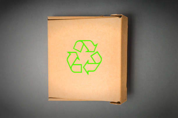 istock Cardboard box with recycle sign isolated on a gray background. 640129078