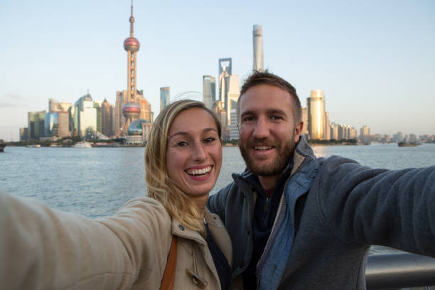 istock Young couple taking selfie in Shanghai 640129180