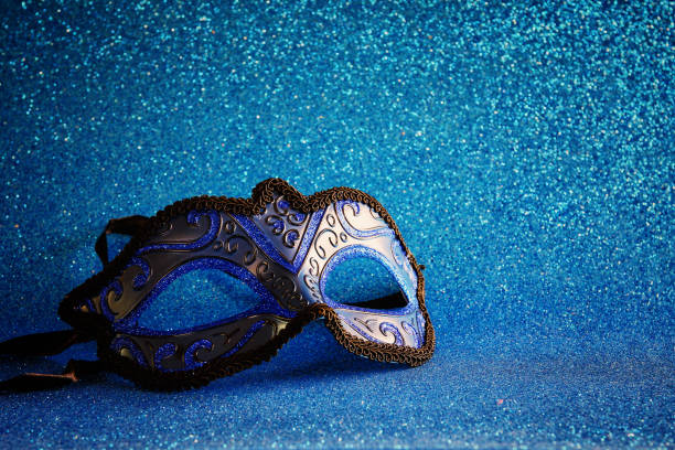 istock elegant venetian mask on blue glitter background 640132840