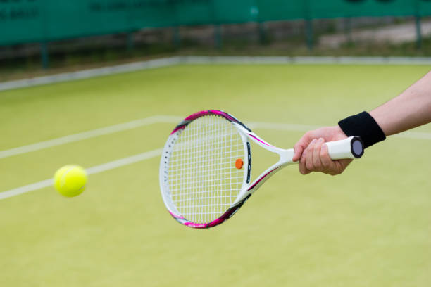 istock Tennis racket and ball in action 640136384