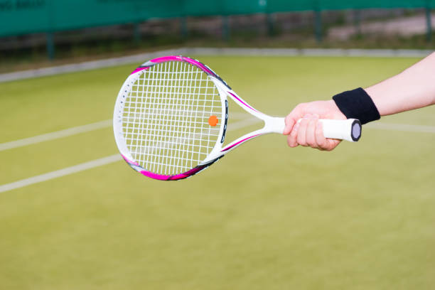 istock Tennis player's hand holding a racket 640136488