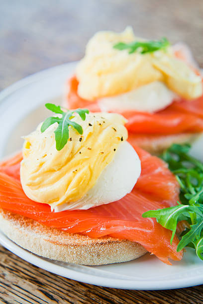 istock Smoked Salmon Eggs Benedict with Hollandaise Sauce on English Muffin. 640138468