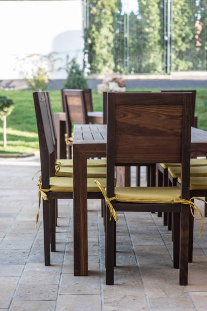 istock Long table and chairs on veranda in luxury villa exterior 640138572