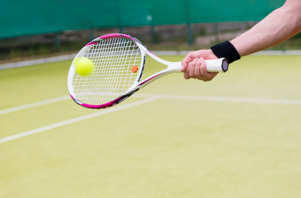 istock New tennis racket and ball in action 640139124