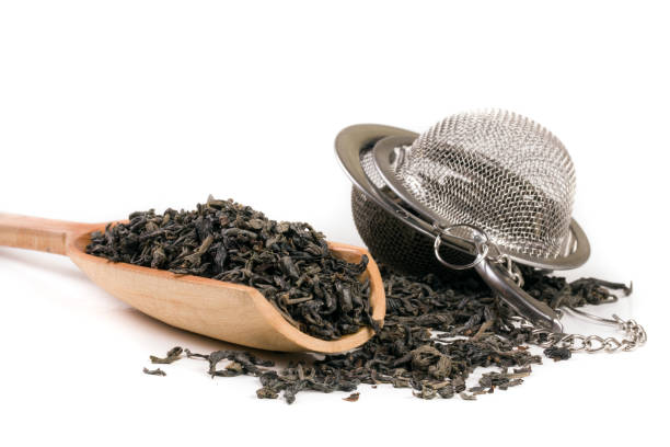 istock tea strainer with a wooden shovel isolated on white background 640139920