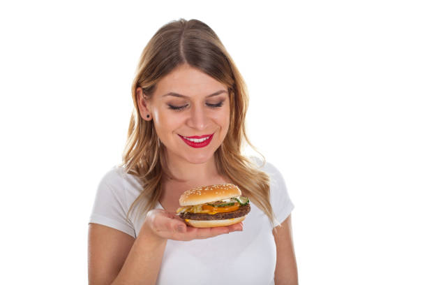 istock Beautiful young woman with hamburger 640140810