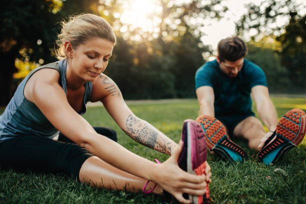 istock Beautiful young woman stretching with man 640141562